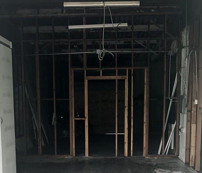 A photo of a building with exposed framing.