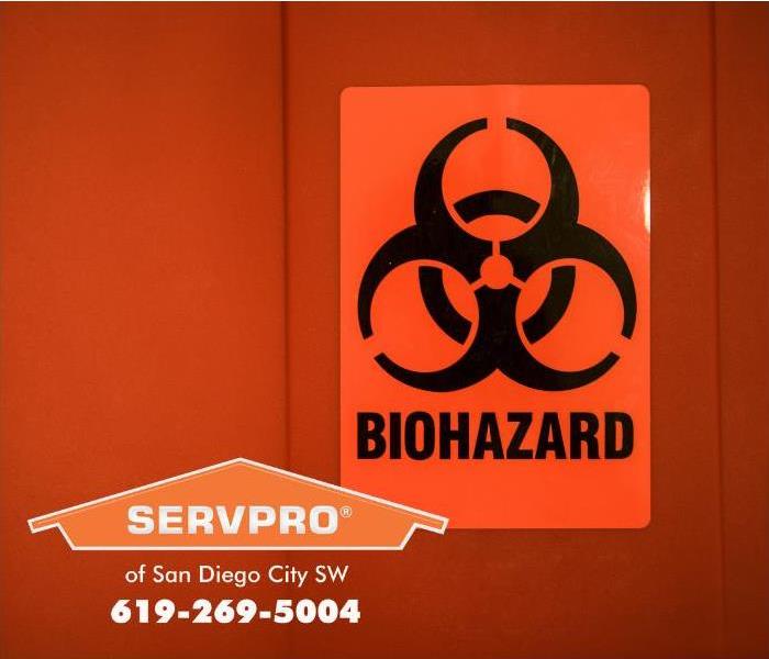 A biohazard warning sign is shown on a container door. 